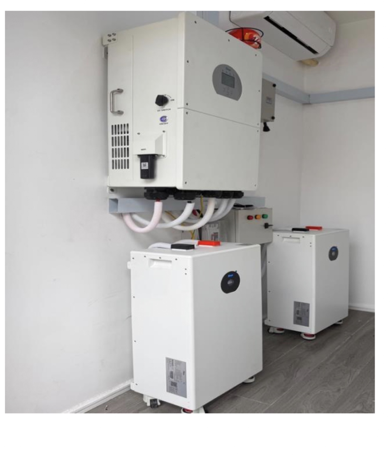 16 kW residential solar installation with hybrid inverter and two lithium batteries for a two-bedroom Airbnb apartment