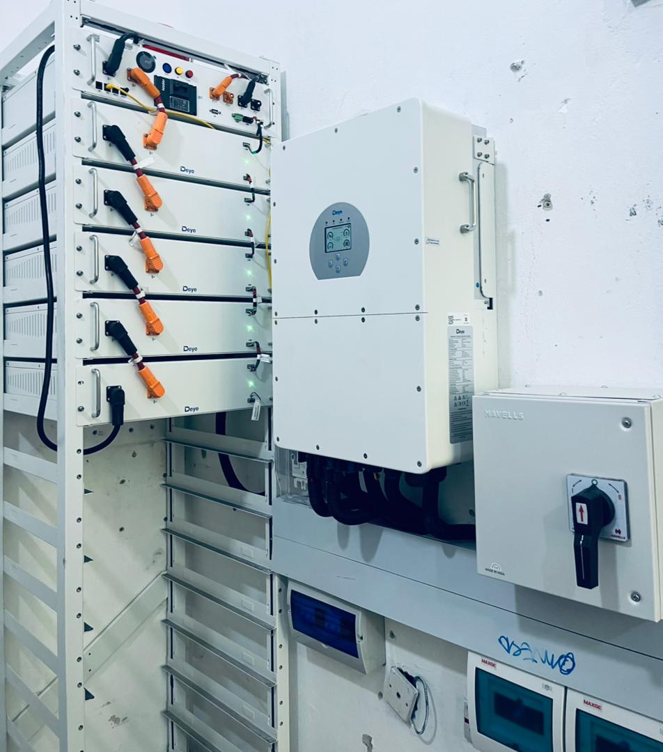 Industrial solar system with stacked lithium battery racks and dual inverters in Nigeria