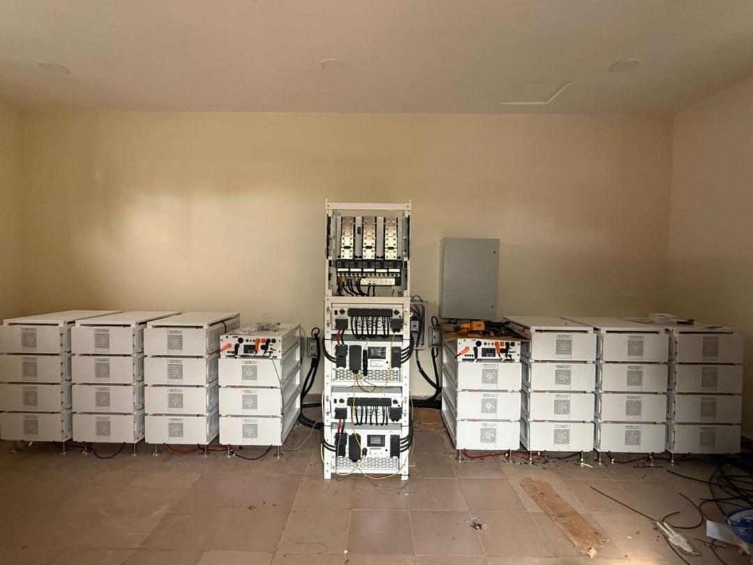Stacked lithium battery bank and inverter installation by Solar World Electric